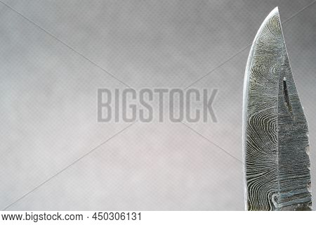 Hand-forged Knife Made Of Several Layers Of Steel With An Exclusive Pattern Photographed In The Stud