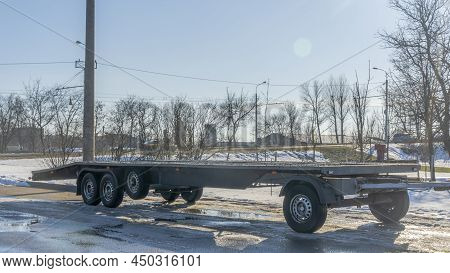 Open Car Trailer For Transportation Car For Sale And Evacuation Wrecked Car. Big Empty Open Platform