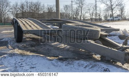 Open Car Trailer For Transportation Car For Sale And Evacuation Wrecked Car. Big Empty Open Platform
