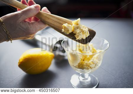 Wooden Spoon With Mayonnaise Sauce With A Lemon And A Mixer