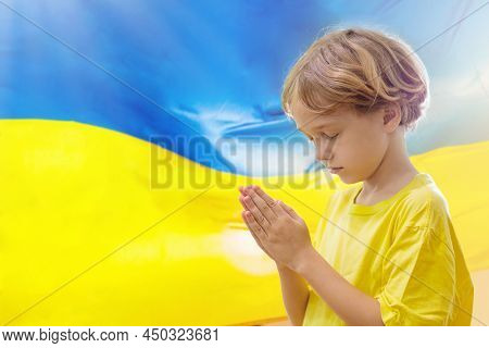 Pray For Ukraine. Child With Ukrainian Flag.