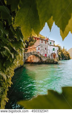 Nesso, Italy - May 2021: Village Of Nesso With The Medieval Bridge, Also Called Civera Bridge, On La