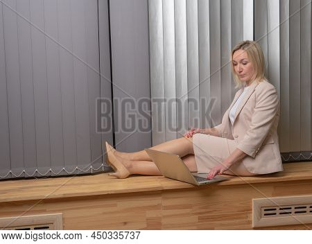 Girl Typing In A Laptop In A White Business Lady Suit, A Concept Independent Feminist Woman Laptop H