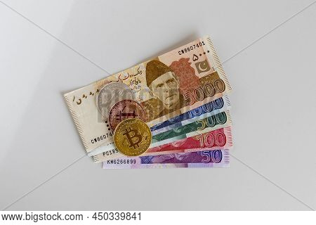 Bitcoins Crypto Currency Coins And Pakistan Currency Banknotes