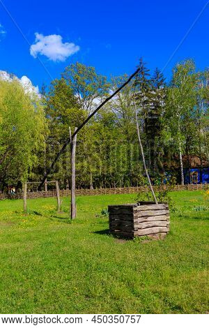 Old Traditional Wooden Shadoof In Village In Ukraine