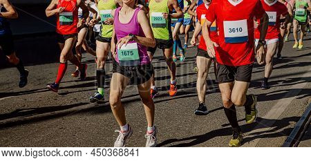Group Male And Female Runners Run City Marathon