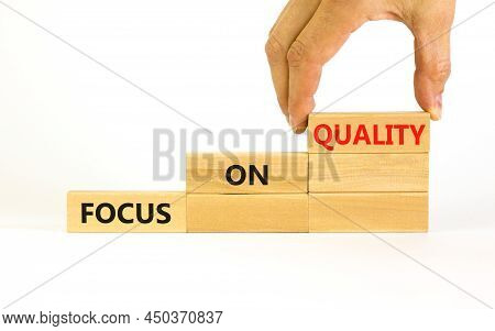 Focus On Quality Symbol. Concept Words Focus On Quality On Blocks On Beautiful White Table White Bac