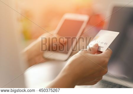 Close Up Woman Hands Holding Credit Card And Using Smart Phone For Shopping Purchasing Online. Mobil