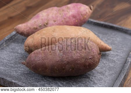 Colorful Root Vegetables Pink, Purple And Orange Organic Sweet Potatos