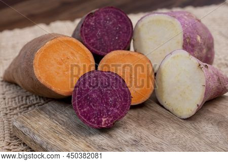 Colorful Root Vegetables Pink, Purple And Orange Organic Sweet Potatos