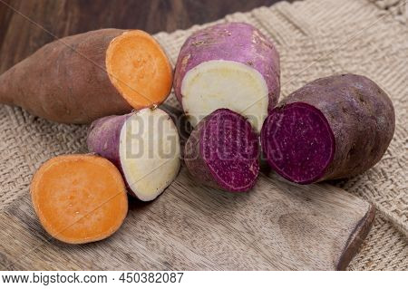 Colorful Root Vegetables Pink, Purple And Orange Organic Sweet Potatos
