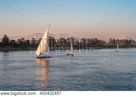 Luxor, Egypt - January 5 2011: Traditional Felucca Sailboat Near Luxor On The River Nile, A Boat Wit