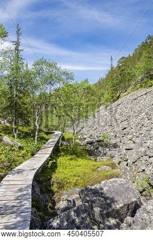 View Of The Pyha-luosto National Park In Summer, Wooden Walkway, Trees And Rocks, Lapland, Finland