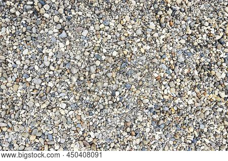 Small Round Stones Lie Under The Feet Texture Background