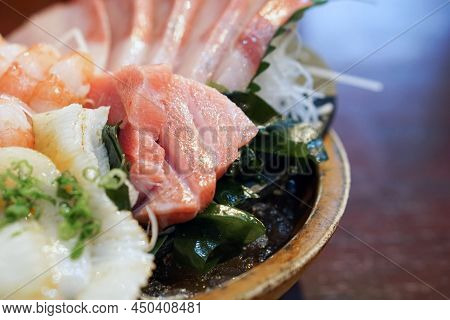 The Sashimi Set Is Beautifully Arranged In A Wooden Plate. Japanese Cuisine Buffet. Chef's Choice: T