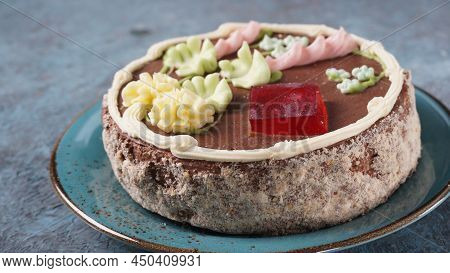 A Kyiv Cake On A Blue Plate. It's A Brand Of Dessert Cake Made In Kyiv, Ukraine. Kyiv Cake With Choc