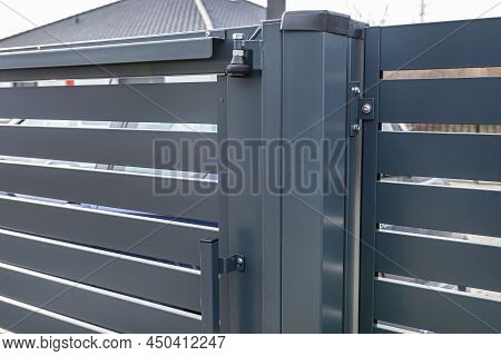 Modern Sliding Entrance Gate In Anthracite Color, Visible Upper Guide Rollers.