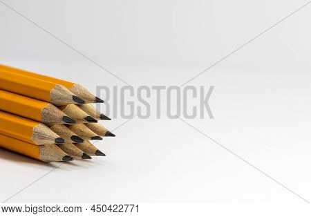 Stack Of Pencils On White Background. Copy Space