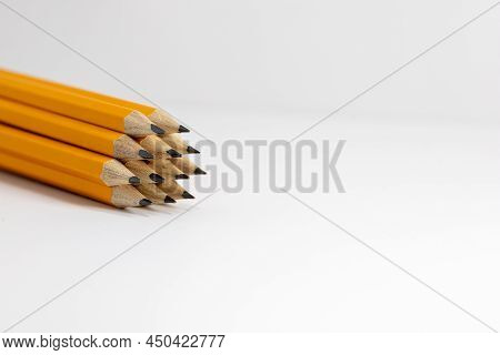 Stack Of Pencils On White Background. Copy Space