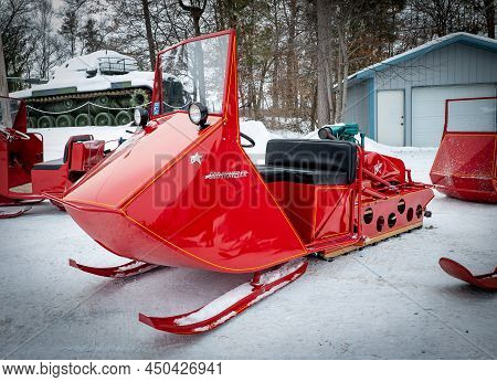 Nisswa, Mn - 5 Jan 2022: Red Antique Polaris Sno-traveler Snowmobile.