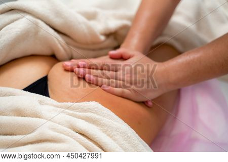 Facial Massage. A Woman Is Given A Massage In A Beauty Salon. Close-up.