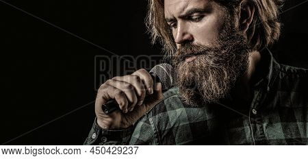 Man Singing With Microphone. Male Singing With A Microphones. Bearded Man In Karaoke Sings A Song In
