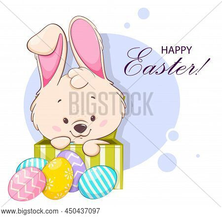 Happy Easter Greeting Card. Funny Cartoon Character Rabbit Sitting In A Box Near Colored Eggs. Easte