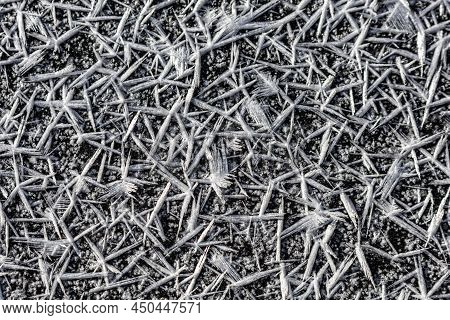 Ice Crystals Forming On Surface Of Frozen Pond