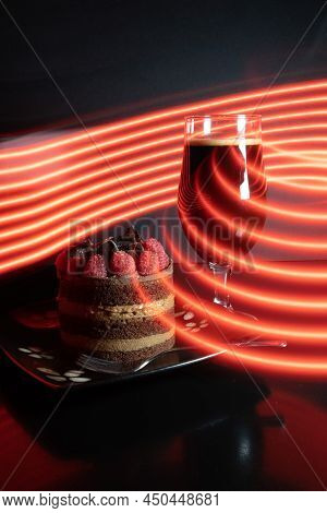 Chocolate stout beer with chocolate cake and raspberries