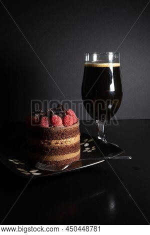 Chocolate Stout Beer With Chocolate Cake And Raspberries