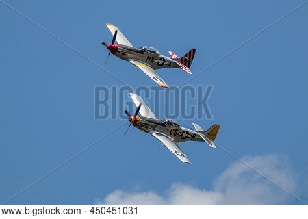 Rochester Ny, Usa
8-25-2019 : Two P51 Mustangs Flying In Unison At Rochester Airshow