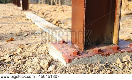Nuts And Nut On The Cement Base. Weld The Posts To The Base Plate And To The Foundation With Constru