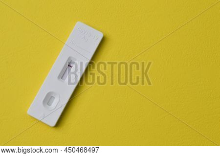 Covid-19 Antigen Rapid Test Isolated On A Yellow Background