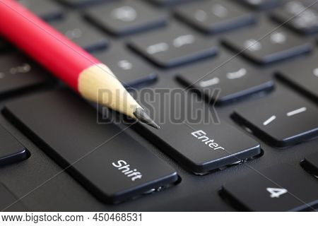Red Pencil On A Keyboard. Macro Shot