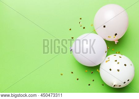 Background With Fastive Air Balloons Of Round Shape And Confetti, Multicoloured Top View. Birthday P