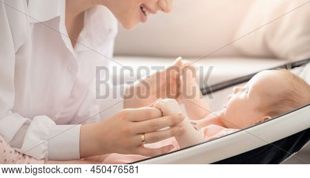 Baby Lies In Automatic Carrycot, Sunlight At Home