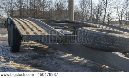Open Car Trailer For Transportation Car For Sale And Evacuation Wrecked Car. Big Empty Open Platform