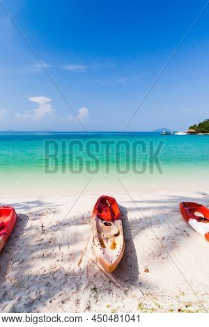 Sea Kayaks On The Sand Beach On Sunny Summer. Luxury Resort In The Background. Koh Talu Island, Thai