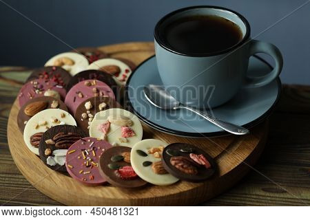 Cup Of Coffee With Chocolate On Wooden Table
