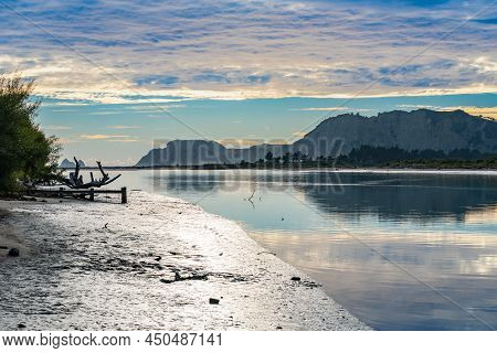 Low Cloud At Dawn Over Coastal Tolaga Bay Reflected In Calm Uawa River Water On East Coast New Zeala