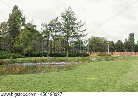 Strengthening The Banks Of The River, Mesh And Stones. Landscape River Bank And Large Stones With Me