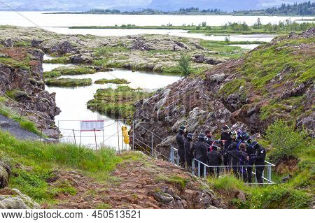 Silfra, Iceland On July 28, 2021: Snorkeling At Silfra Rift, Cold Waters In Iceland
