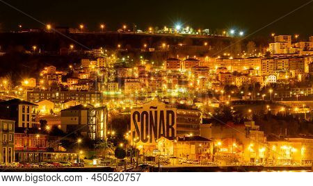 Bilbao, Spain-december 19, 2021 : Cityscape Of Bilbao City In The Night With Orange Light Of Street 