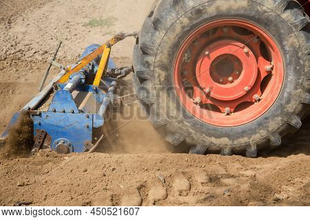 Field Preparation By Rotary Tiller Tractor In Farm