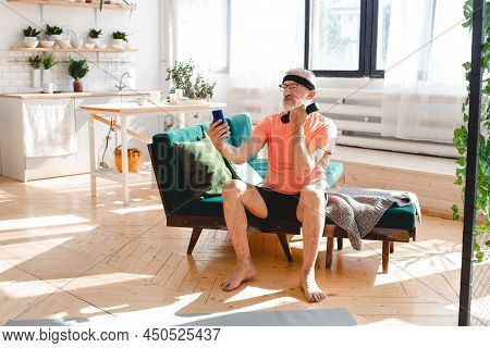 Elderly Aged Male Taking Selfie For Social Network During Exercising With Dumbbells. Old Person Man 