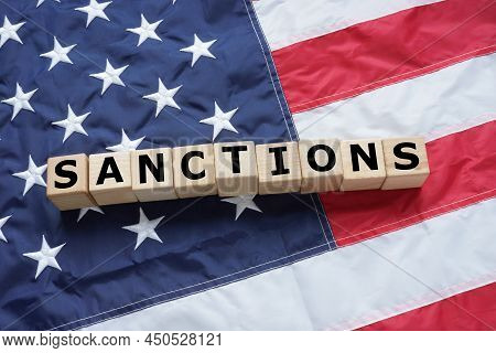Sanctions Are Depicted On A Cubes That Lie On The Usa Flag