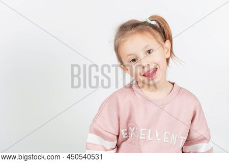 Little Girl Shows Myofunctional Trainer. Dental Tariner Is Made To Correct Bite