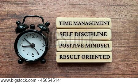 Wooden Blocks With Text - Time Management, Self Discipline, Positive Mindset, Result Oriented.