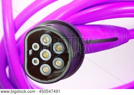 A Colored Charging Cable For Electric Cars Against A White Background.