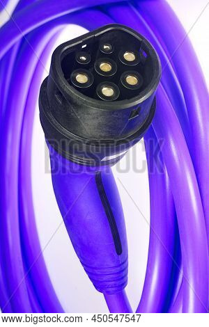 A Colored Charging Cable For Electric Cars Against A White Background.